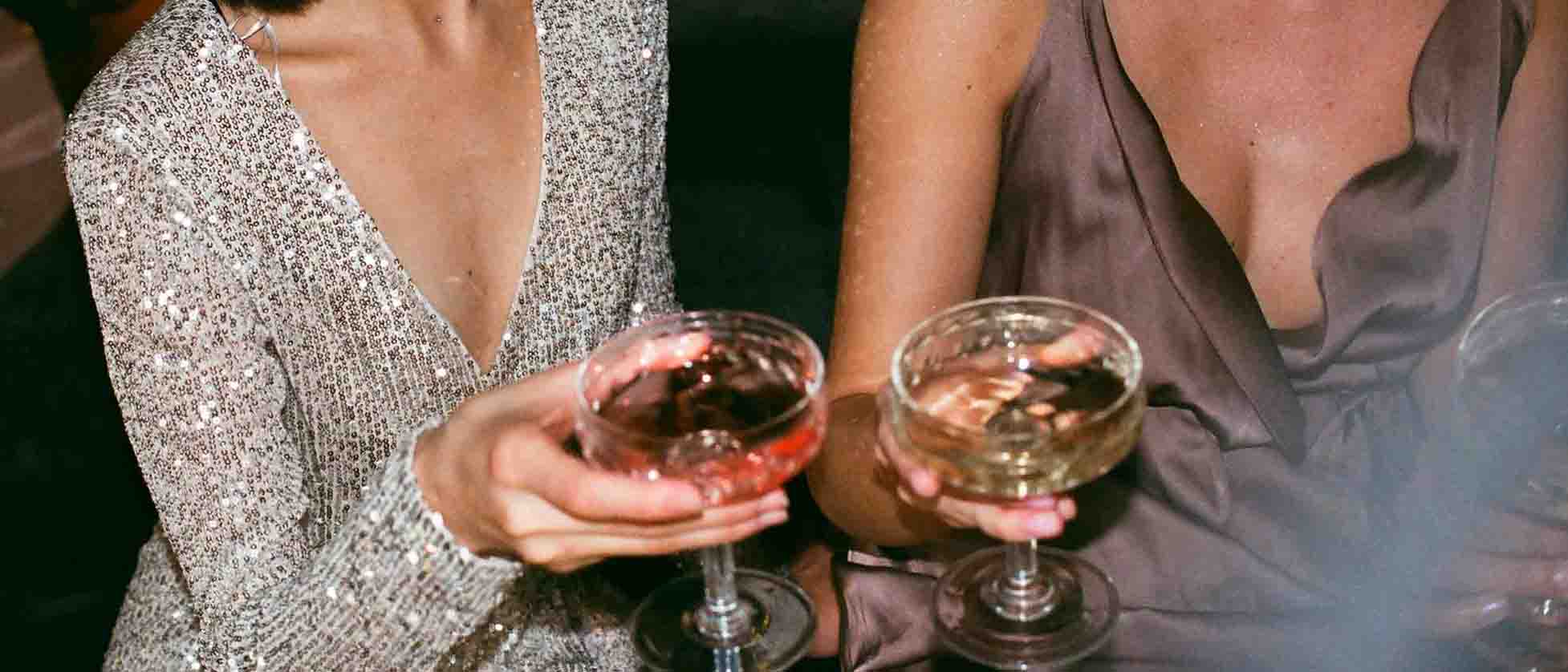 Guests raising Champagne glasses at a private party at Lulu Wild, Birmingham