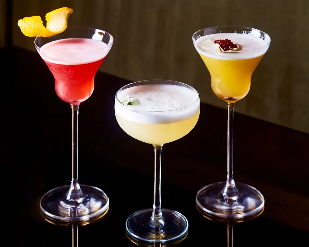 Three house cocktails on the bar at Lulu Wild cocktail bar in Birmingham