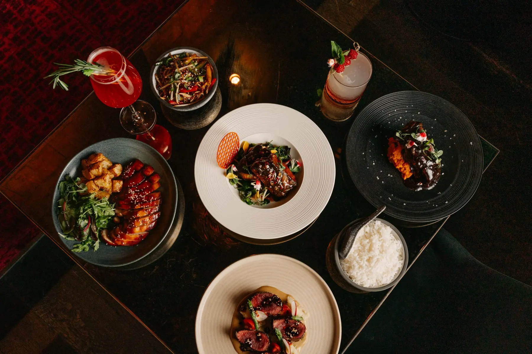 Christmas set menu mains and sides shared across a table at Lulu Wild, Birmingham